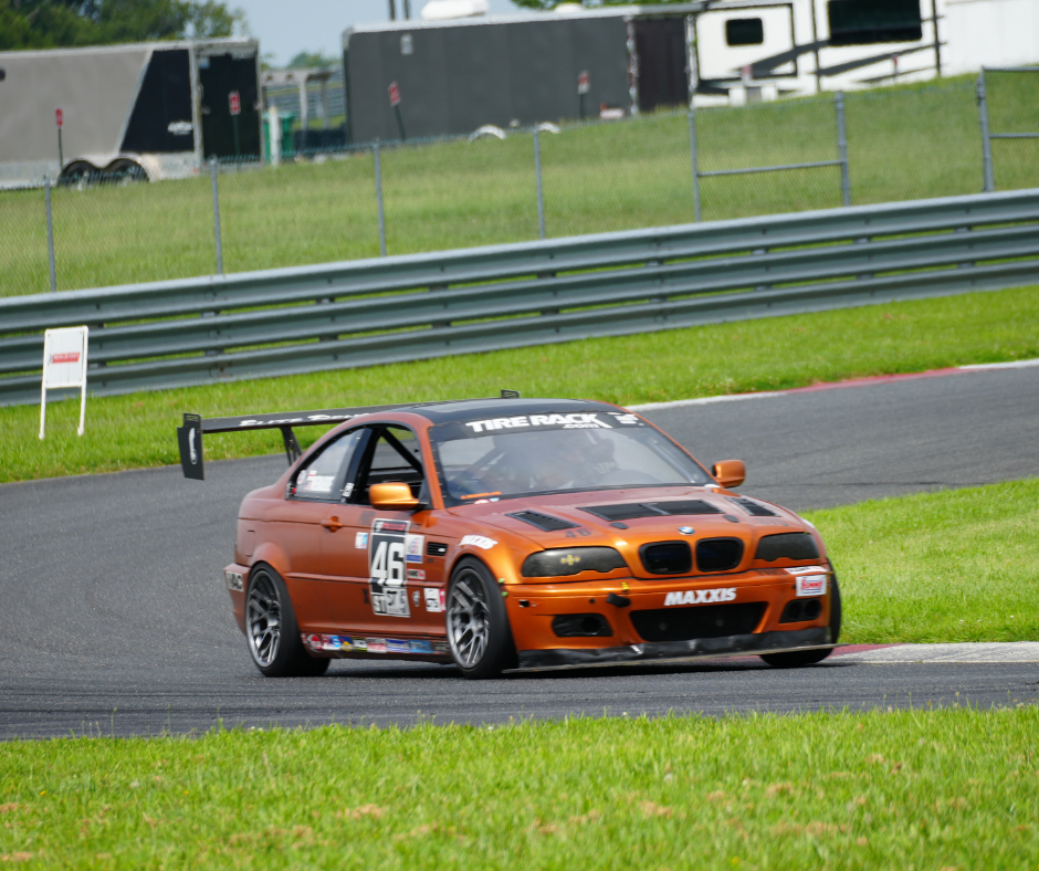 Seat Control and Mirror Positioning Image of Orange Race Car